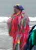 Playing fife for Freaks on the beach, Whitby, 2003. Just out of shot Keith is about to whack me one with a very big Morris stick.